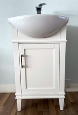 SMALL-SIZED VANITY WITH FULL-SIZED SINK AND FAUCET W/ PLUMBING LINE ATTACHMENTS