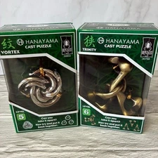 NIB Hanayama Cast Metal Brain Teaser Puzzles Vortex & Trinity