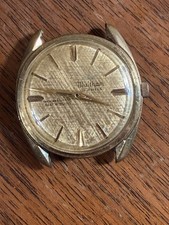 Waltham 21-jewel automatic mechanical watch, shock-resistant, gold-tone dial.