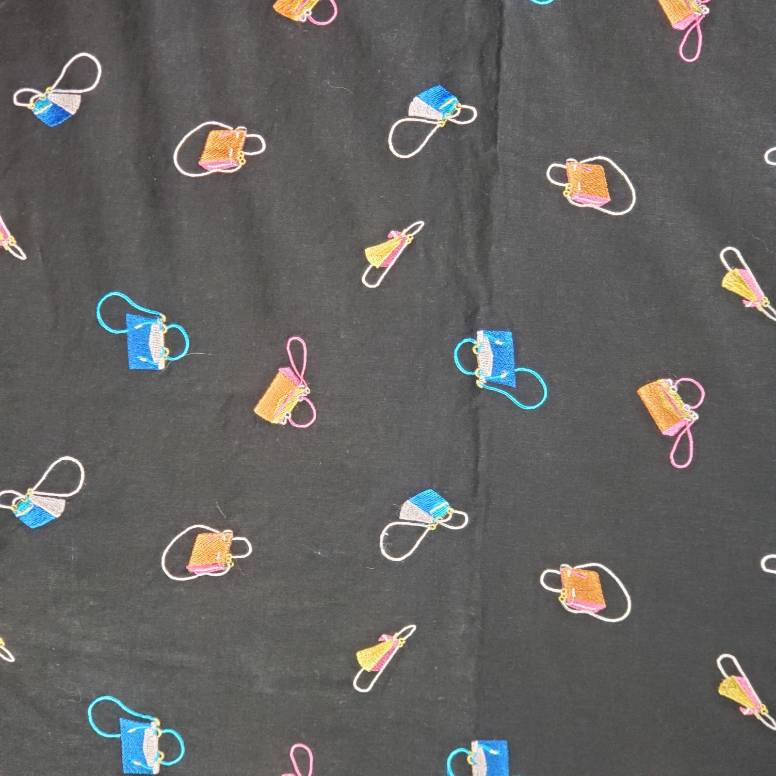 Embroidered Handbags on Black Background for Sewing and Quilting Fabric Crafts  