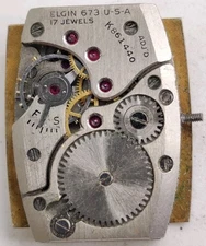 Vintage Elgin Cal. 673 17 jewel watch movement Runs For Repair 
