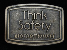 QG13109 VINTAGE 1970s THINK SAFETY MOTOR WHEEL BRASSTONE BELT BUCKLE