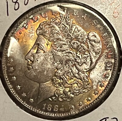 1884-o Morgan dollar , Brilliant Uncirculated beautiful toning !