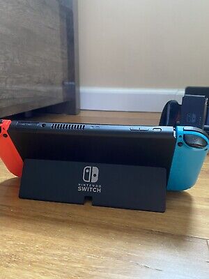 Nintendo Switch – OLED Model w/ Neon Red & Neon Blue Joy-Con