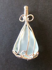 Sea glass pendant light blue/green in sterling silver wire