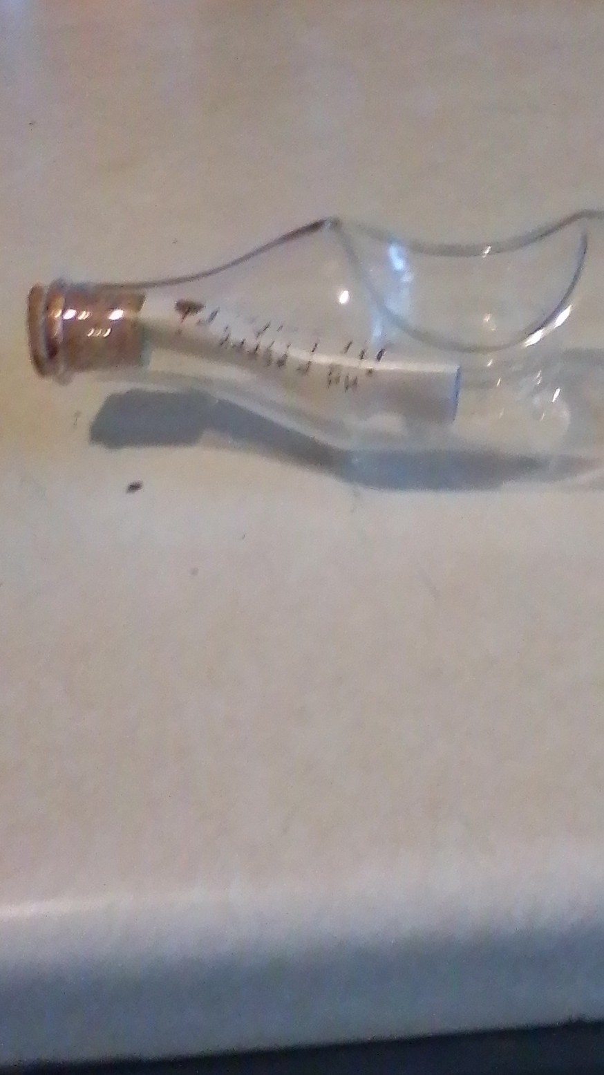 Clear Glass Bottle with Cork and Rolled Paper Message
