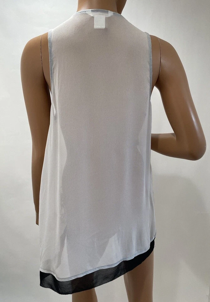 Top esley sin mangas talla grande blanco gasa bordado  Foto 4 de 4