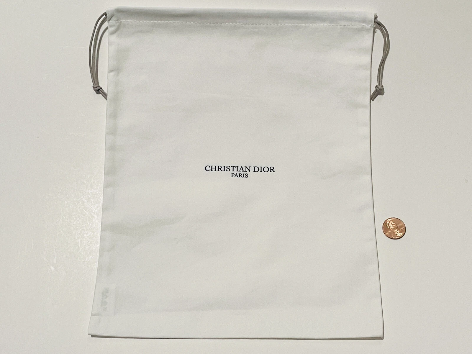 Sac cordon de serrage blanc neuf CHRISTIAN DIOR 9x11”