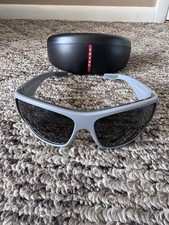 PRADA SPS 04V. Polarized Sunglasses. Gray Frame. Black Lens for Men