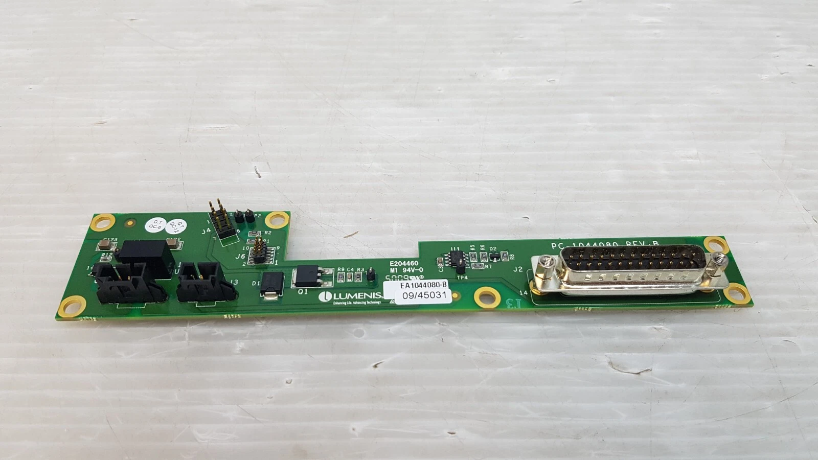 Angled view of the Lumenis EA1044080-B laser deck board