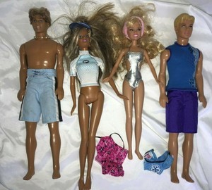 4 barbie dolls