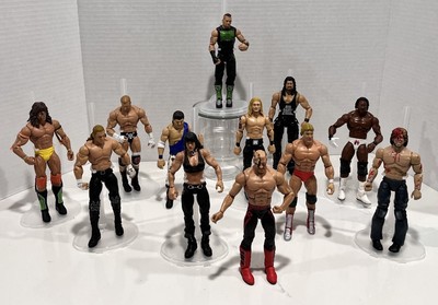 WWE AEW 12 Action Fig 7-2011, 2-2012, 1-2014, Hawk Leg. Doom 2019, 1 Kenny Omega