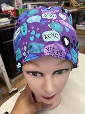 surgical cap with buttons