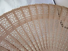 Vintage pierced wood ladies fan. Plain