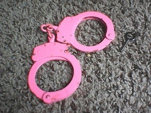 pink meatal hand cuffs