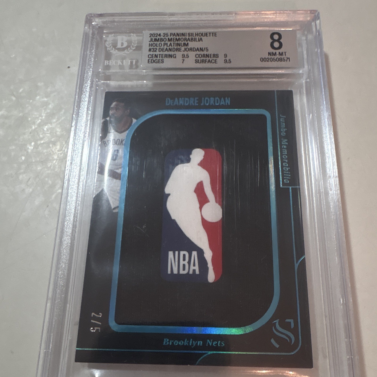 Logoman Panini 2024-25 Silhouette DeAndre Jordan Jumbo Memorabilia Holo /5 BGS 8 view 1