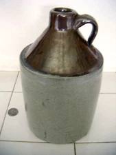 1 gallon stoneware jug carnival lustre glaze on top SEE