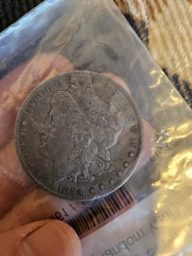 1884-O VF Morgan Silver Dollar, in clear APMEX bag