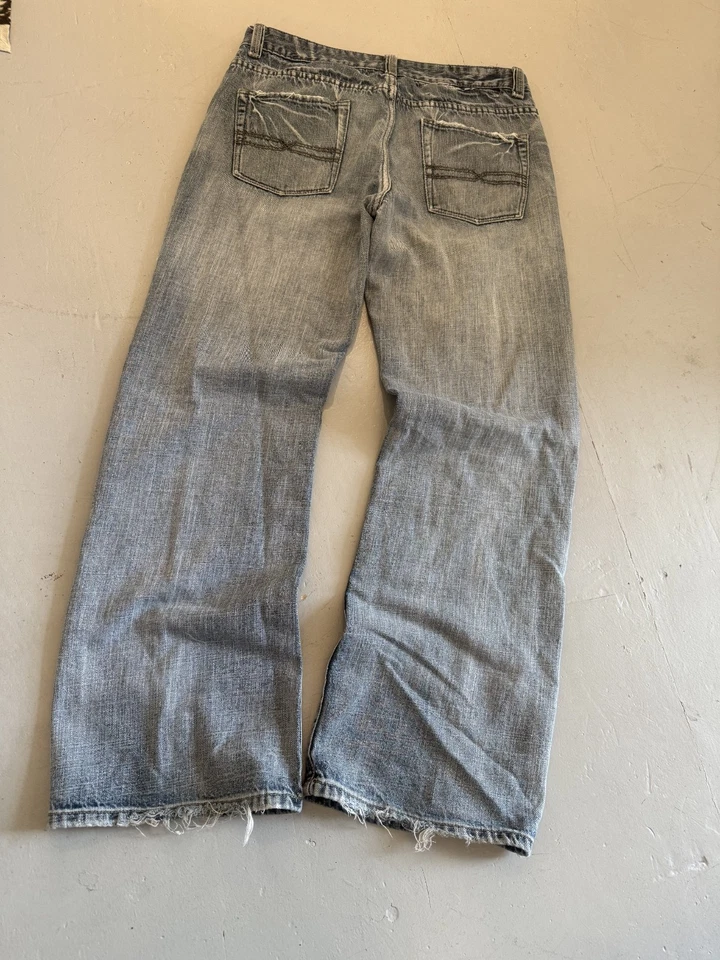 Jeans vaqueros holgados de pierna ancha Y2k/90s-2000s corte bootcut acampanado desteñido usados en talla 34 Foto 2 de 4