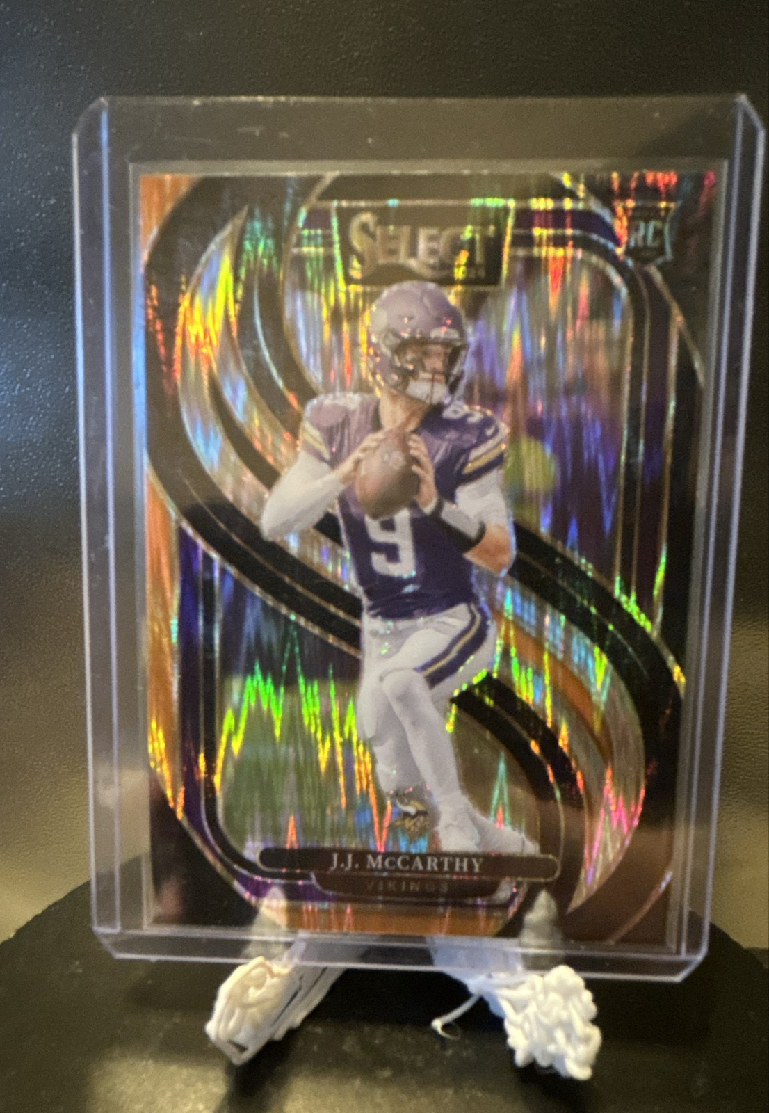 2024 Panini Select - Premier Level JJ McCarthy 134 Black & Orange Shock Prizm RC