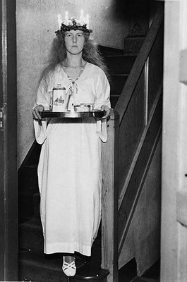 Barbro Zimmerman wearing traditional dress carries a tray of coffe- Old Photo