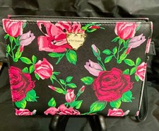 Betsey Johnson pink and red colored roses on black cosmetic bag