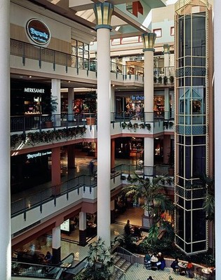 Photo:Mall atrium 1980s multi-level interior escalator shops and columns