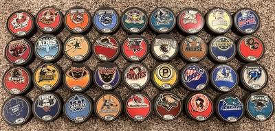 Lot Of 29 Vintage AHL Souvenir Pucks