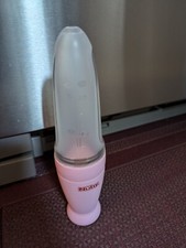 Nuby New  Improved Silicone Food Dispensing Squeeze Feeder w Cover  Stand Pink