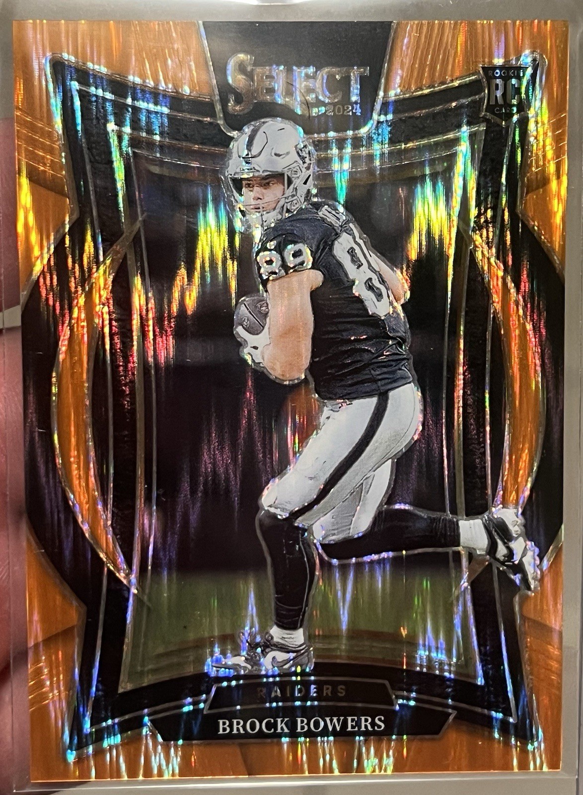 2024 Panini Select - Concourse Brock Bowers Orange Shock Prizm /499 (RC) Raiders