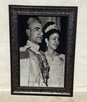 A Framed Rug Depicting the Shah and Queen Farah