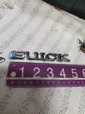 75-87 Regal " BUICK "Script Trunk Deck Lid Emblem Adhesive Back GM NOS #1701932