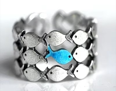 ''Swim against the current'' ring (blue fish)