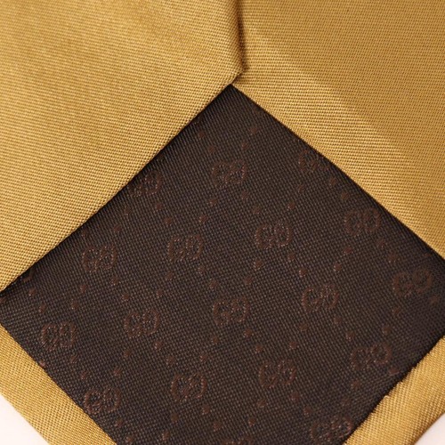 Męski złoty jedwabny krawat Gucci nieużywany klasyczny solidny wzór szerokość 7,5 cm - Zdjęcie 7 z 10