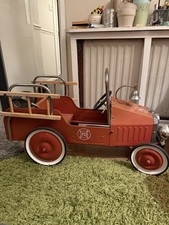 Vintage-style pedal car fire engine.