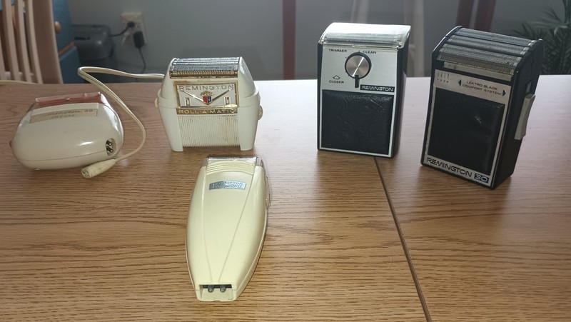 AN ASSORTMENT OF OLD REMINGTON SHAVERS FROM THE 1940’S TO THE 1980’S.