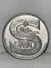 Gettone Singer con francobollo incapsulato da 10 cent