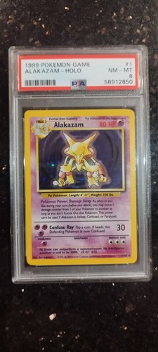 1999 Pokémon Base Set Alakazam 1/102, PSA 8 (NM-MT)