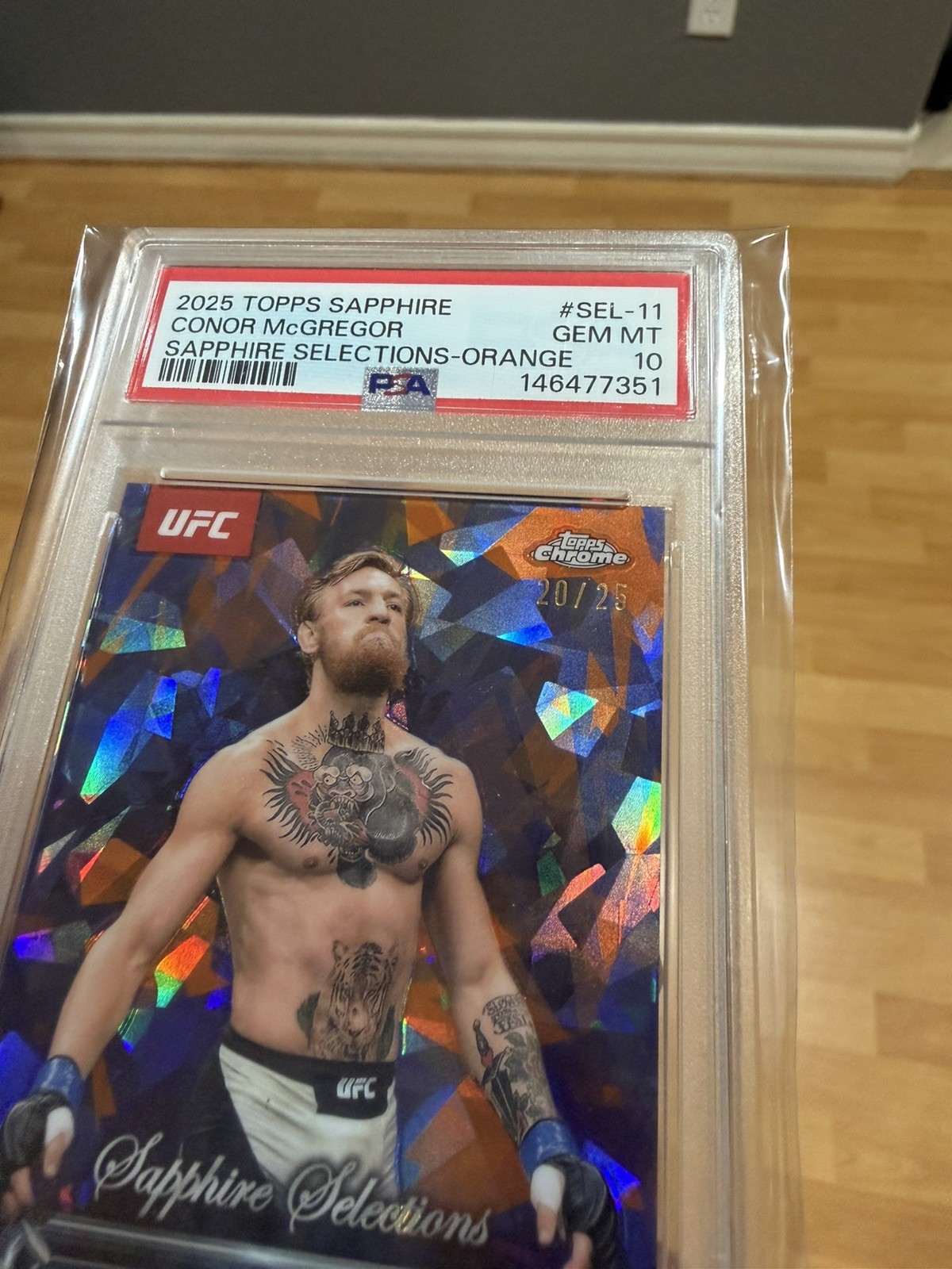 2025 Topps Chrome Sapphire UFC Conor McGregor Sapphire Orange /25 PSA 10 view 2