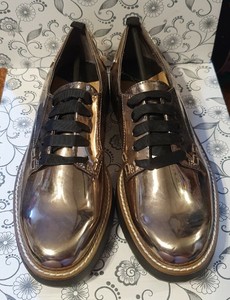 black and silver flat shoes