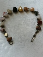Bracciale antico da donna  color argento formato da varie pietre  degli anni 70