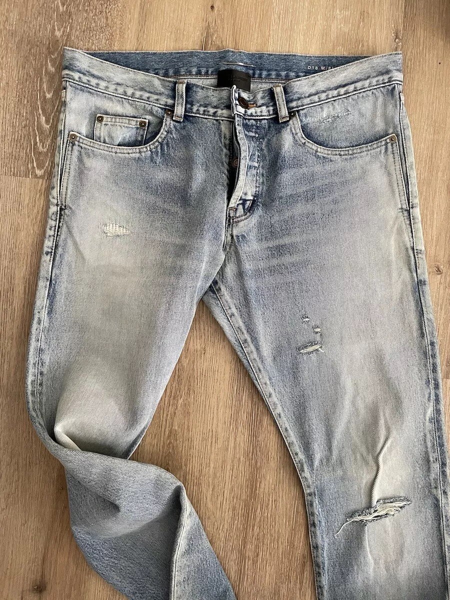 Jeans uomo Saint Laurent slim strappato al ginocchio blu. Taglia 32