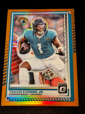 2025 Panini Donruss Optic Travis Etienne Jr. #106 /299 Orange Prizm