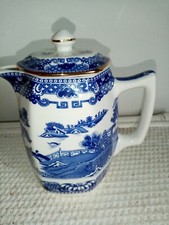 Wade ware Ringtons Tea Merchants  willow pattern jug. 