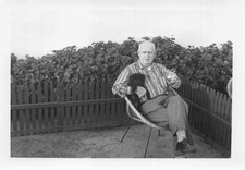 Vintage Man Sitting Outside Puppy Dog Lap Cocktail 1950s Photo Glass Ice Furry