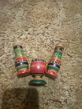 vintage, hand-carved wooden salt and pepper shakers with a toothpick holder