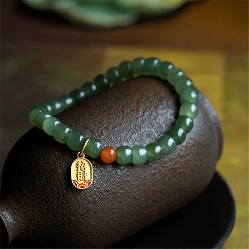 Jade bead sales bracelet with gold