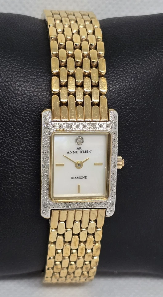 Reloj de cuarzo para mujer Anne Klein diamante tono dorado esfera mop correa 09 Foto 3 de 4