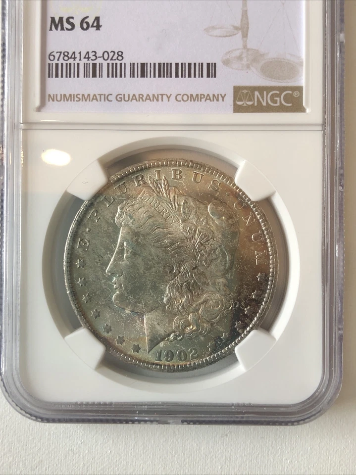 United States 1902 Silver Morgan Dollar Coin Toned NGC MS 64 - Image 2 of 4