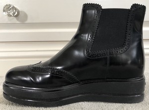 black patent brogue boots